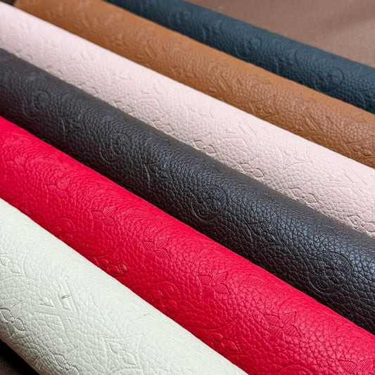 INWARD EMBOSSED LOGO LEATHER