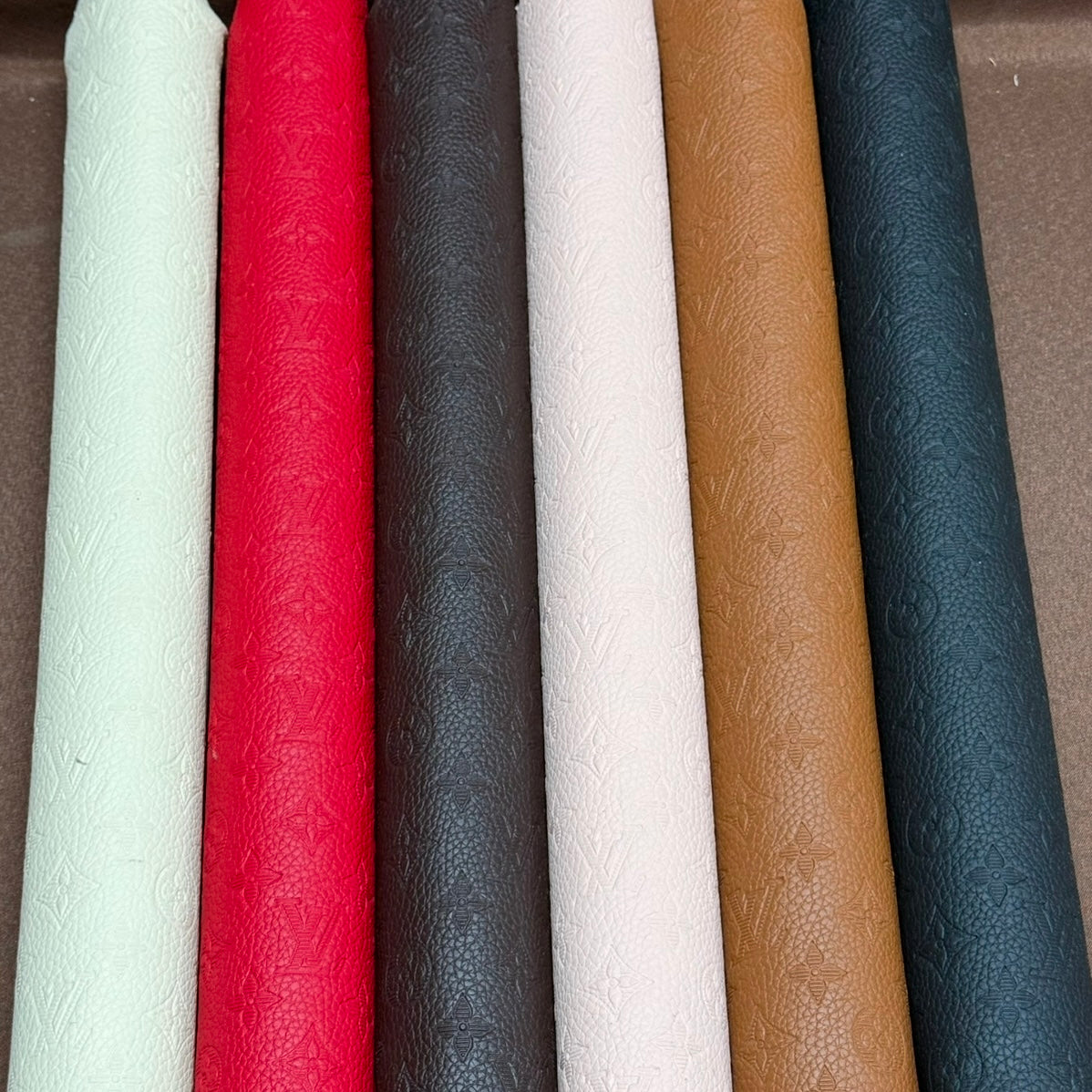 INWARD EMBOSSED LOGO LEATHER