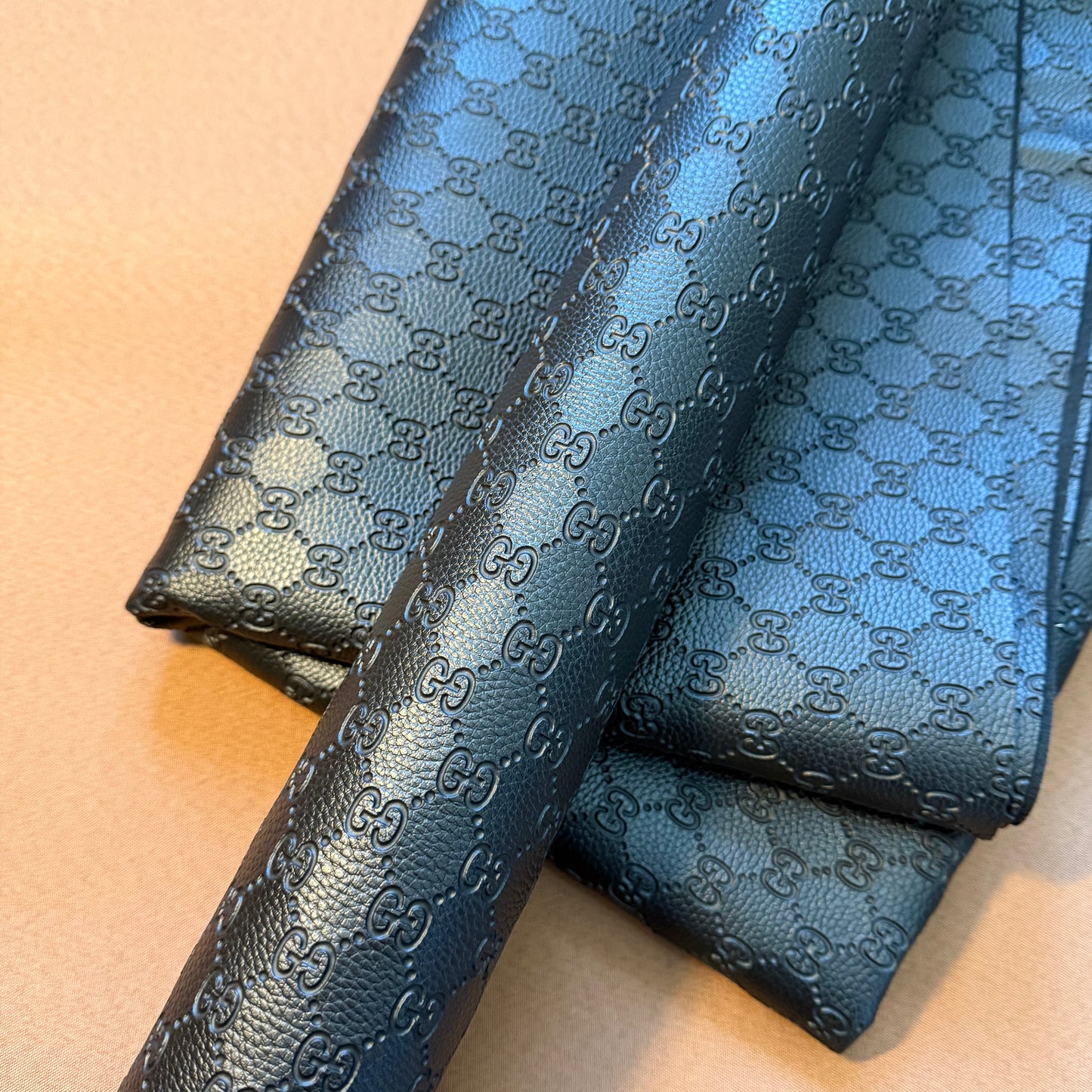 INWARD EMBOSSED LOGO LEATHER